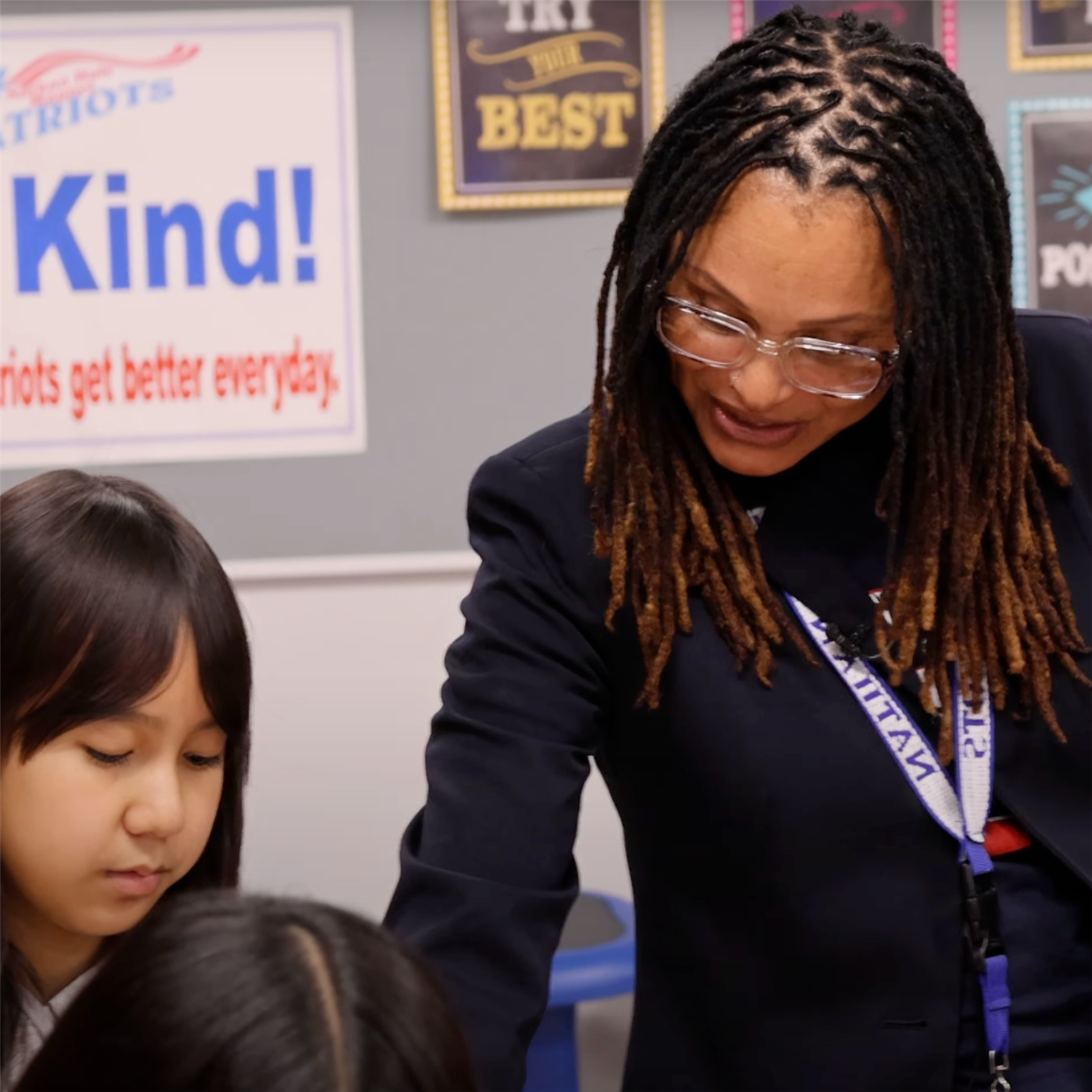  Kim Langford works with a student on an assignment